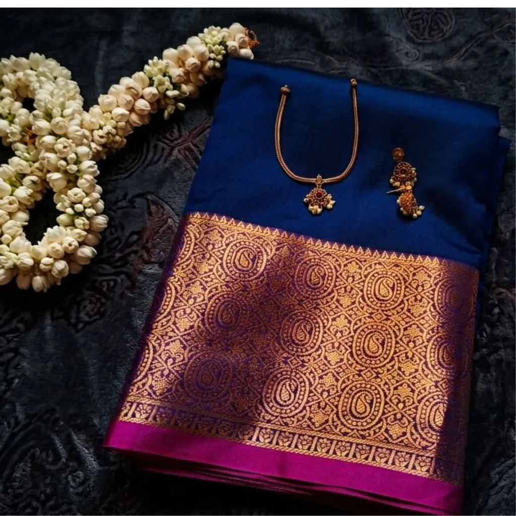 Royal blue saree blouse with traditional gold jewelry set for Onam collection